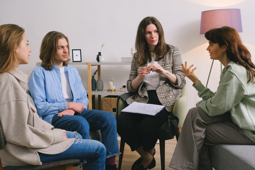 Working AA Step 1: Expectations, Goals and the Bigger Picture 4 photo of 4 individuals in a therapy session